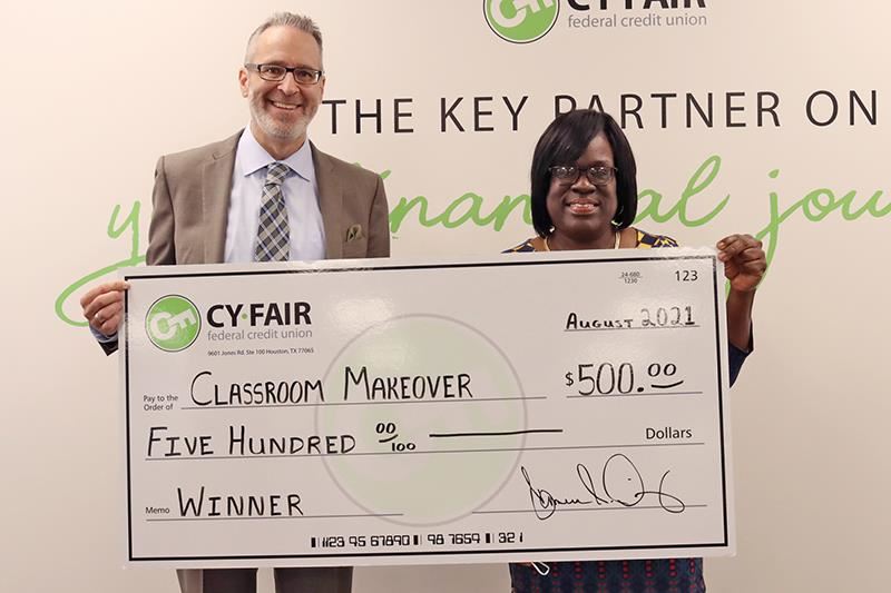 From left, Cameron Dickey, Cy-Fair Federal Credit Union president and CEO, and Cy Springs teacher Eliza Dorsey.
